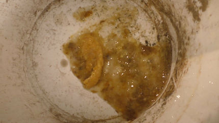 BRUNETTE LADY PUKES HERSELF IN THE BUCKET..