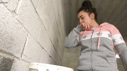 BRUNETTE LADY PUKES HERSELF IN THE BUCKET..